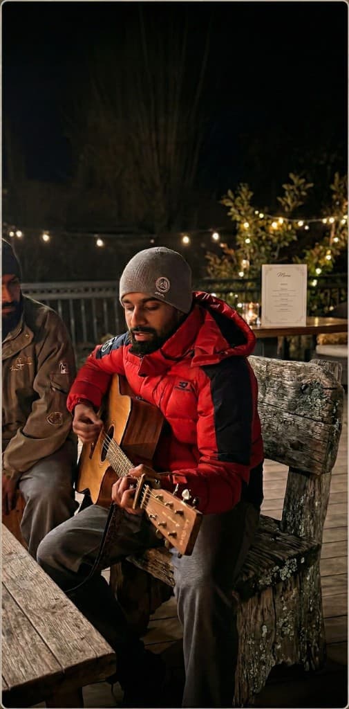 Live singer performing at Salud villa under the Shivalik Hills sky